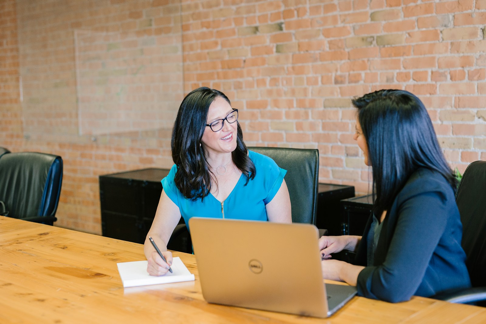 Professional woman presenting financial work in a business setting